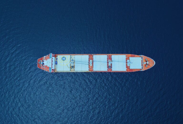 an aerial shot of a ship on a sea