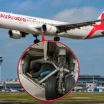 Air Arabia passenger aircraft at Gatwick Airport after an unidentified man was found dead in its landing gear