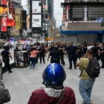 NYPD officers investigate a police shooting near Times Square in Manhattan