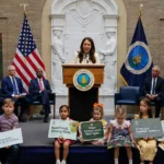 US school nutrition event with children holding healthy food signs as officials speak at a podium